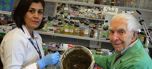 jpg UBC researchers Julian Davies and Shekooh Behroozian with a bucket of clay.