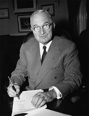 jpg President Harry Truman in his White House office in Washington Dec. 16, 1950 signs a proclamation of a state of national emergency