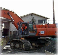 Energized Power Line Down On Top of Excavator