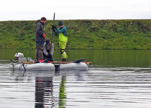 jpg Researchers working with ecologist Nancy Bigelow pull a sediment core from a deep lake in western Alaska near Shishmaref, looking for pollen preserved from the days of the Bering land bridge.