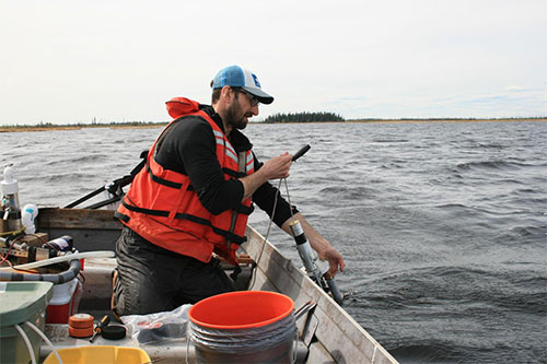 jpg Study lead Matthew Bogard, a University of Washington postdoctoral researcher, samples water from Canvasback Lake in Yukon Flats National Wildlife Refuge