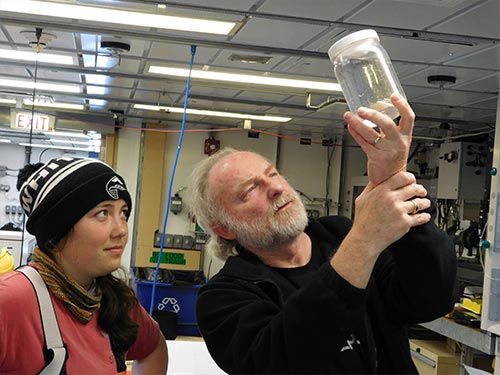 jpg Russell Hopcroft, a professor at UAF’s College of Fisheries and Ocean Sciences, and graduate student Alex Poje examine the results of a plankton net tow.