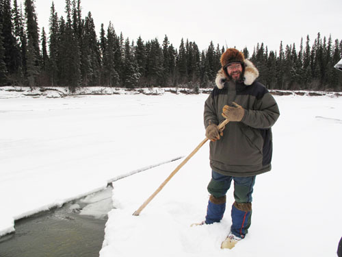 jpg UAF ecologist Knut Kielland checks out a mysterious hole in the ice of the Tanana River.