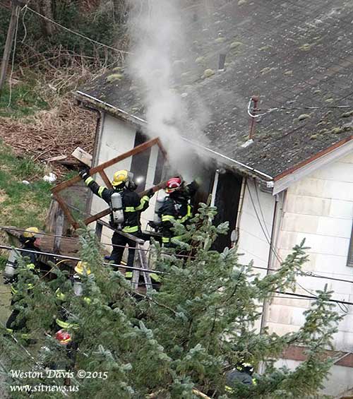 jpg Several unidentified firefighters of the Ketchikan Fire Department engaging the early morning fire at 2112 First Avenue.
