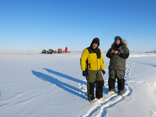 jpg Chris Arp, left, and Ben Jones on the North Slope during a snowmachine journey to study lakes in spring 2014. Guido Grosse of Potsdam, Germany, is in the background. 
Photo by Ned Rozell