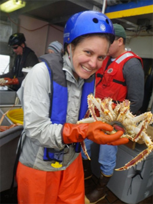 jpg Leah Sloan holds up an infected king crab.