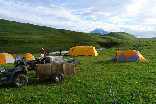 jpg Geologists camped near an upland lake about 0.5 km from the shore of Driftwood Bay, Umnak Island, Alaska. Vsevidof Volcano in the background.