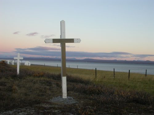 jpg A cross marks a mass grave dug by miners for the bodies of 72 people who died at Brevig Mission in 1918.