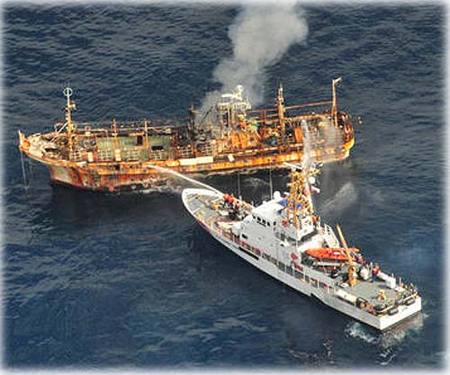 jpg The Coast Guard Cutter Anacapa crew douses the adrift Japanese vessel with water after a gunnery exercise 180 miles west of the Southeast Alaskan coast April 5, 2012. The crew was successful and sank the vessel at 6:15 p.m. in 6,000 feet of water by using explosive ammunition and filling it with water.