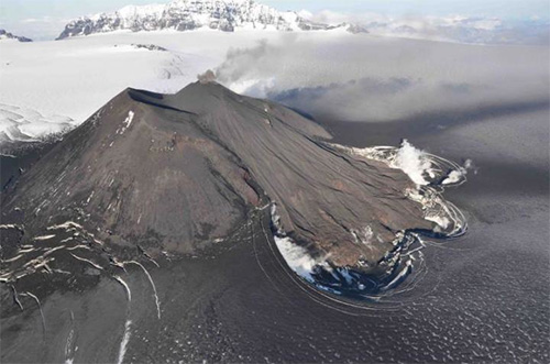 jpg Aerial view of the active vent, erupting intracaldera cone, and new lava flows at Veniaminof Volcano in August 2013.