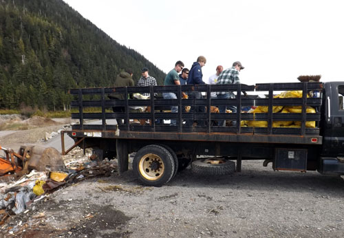 jpg Coast Guard members unloading the 7 ton truck at the landfill 