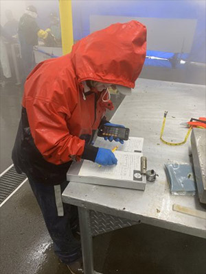 jpg A worker helps track seaweed harvests at a processing plant in Kodiak.