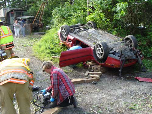 jpg driver has been secured on a long spine board and placed on the gurney