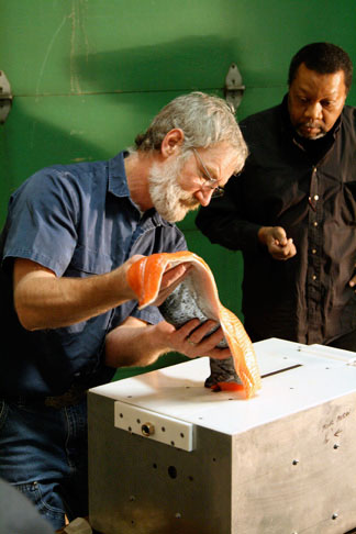 jpg Tim Manning, GI Machine Shop assistant manager, demonstrates the Pinbone Wizard machine in this 2007 photo, while manager Greg Shipman looks on.