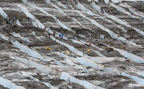 jpg In this June 25, 2012, photo provided by the Army, a Joint POW/MIA Accounting Command (JPAC) recovery team works at the site where military aircraft wreckage was found on Colony Glacier, Alaska. 