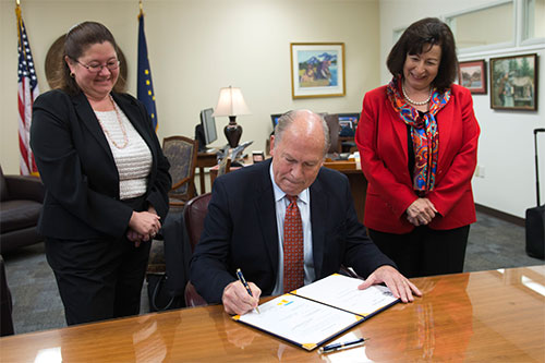 jpg HB 234 signing: Gov. Walker with Rep. Vazquez and staffer