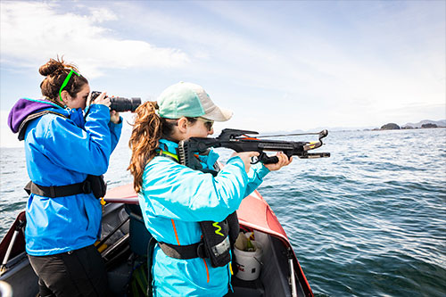 jpg Lauren Wild and Madison Kosma prepare to tag a whale. NOAA permit #18529.