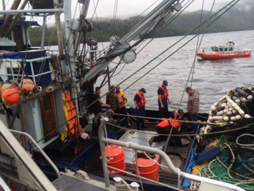 jpg Coast Guard Station Ketchikan boarding team members assist the crew of Fishing Vessel Vernon after their boat began taking on water near Ketchikan, Alaska, July 18, 2014.