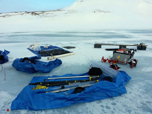jpg Equipment for collecting samples of lake sediment is laid out as part of a research project on St. Paul Island.