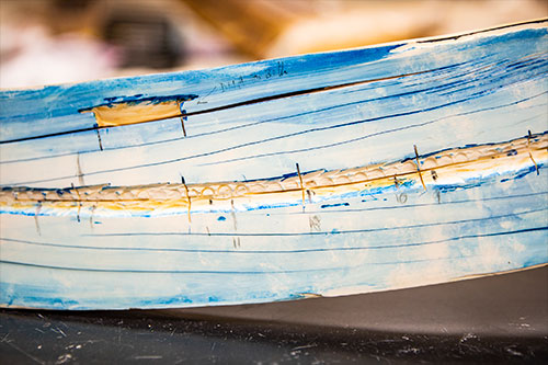 jpg A close-up view shows a split mammoth tusk at the Alaska Stable Isotope Facility. Blue stain is used to reveal growth lines. Samples were taken along the tusk using lasers and other techniques, allowing isotope analysis that provided a record of the mammoth’s life