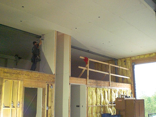 jpg Dawson worker hanging sheet rock at the new South Tongass Fire Station.