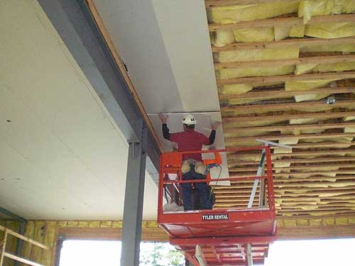 jpg Dawson is currently working on the sheet rock on the ceiling of the apparatus bays on the main floor.