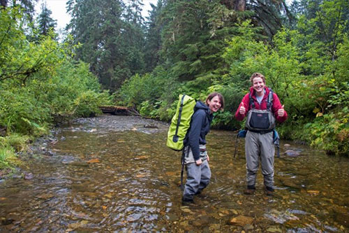 jpg UAS Environmental Science Students Mollie Dwyer (left) and Connor Johnson trek through Montana Creek to obtain water samples Thursday, Aug. 23, 2018 in Juneau, Alaska. 