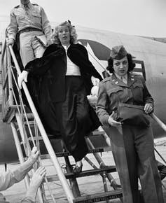 jpg Mildred Gillars, center, known to American GIs in WWII as ‘Axis Sally,’ arrives in the U.S. to face a treason charge.