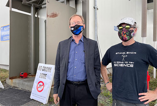 jpg Geophysical Institute Director Bob McCoy poses with visitor Michael Lewis from Anchorage during a recent open house at the HAARP facility