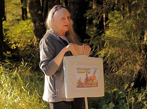 jpg Judy Hendricks holds a sign reading: "When injustice becomes  Law, Resistance becomes Duty..