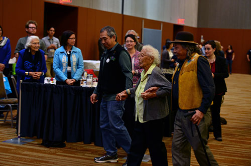 jpg This year’s Shirley Demientieff Award recipient Poldine Carlo is escorted to the stage at the annual Alaska Federation of Natives Convention in Anchorage.