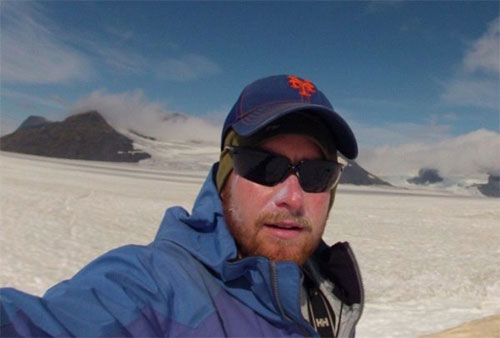 jpg Gerard Ganey enjoys a sunny day at his ice-algae study site on the Harding Icefield.