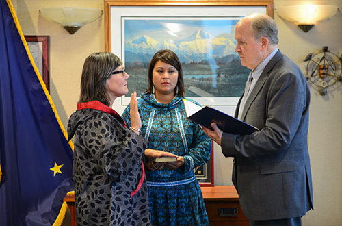 Lieutenant Governor Valerie Nurr'araaluk Davidson (left), Director of Rural and Native Affairs Barbara Blake (center), and Governor Bill Walker (right) participate in the swearing-in ceremony.