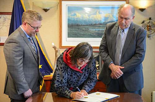 jpg Chief of Staff Scott Kendall (left), Lieutenant Governor Valerie Davidson (center), and Governor Bill Walker (right) participate in the swearing-in ceremony.