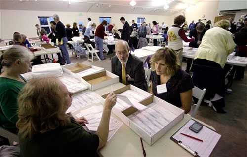 jpg Joe Geldhof, left, observer for Lisa Murkowski and Ivy Frye, observer for Joe Miller check names on ballots 