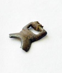 Ancient bronze artifact from East Asia unearthed at Alaska archaeology site; Artifact resembles small, broken buckle, could have been horse ornament 