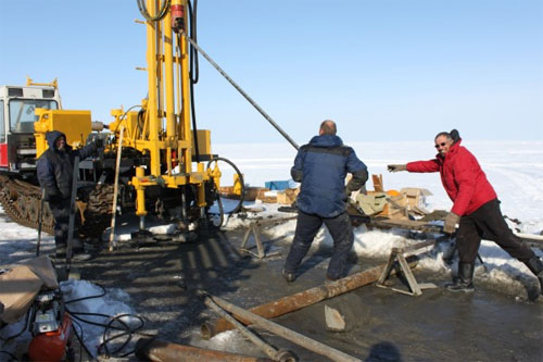 jpg Members of the scientific field expedition drill through the ice and into the seafloor of the East Siberian Arctic Shelf. 