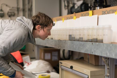 jpg Steffi O’Daly looks at seawater samples from the Bering Strait aboard the UAF research ship Sikuliaq.