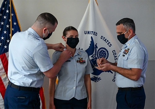 jpg Chief Petty Officer Nathaniel O’Connell and Petty Officer 1st Class Sean Crocker pin Petty Officer 2nd Class Alta Jones, a boatswains mate advancing to Petty Officer 1st Class, at