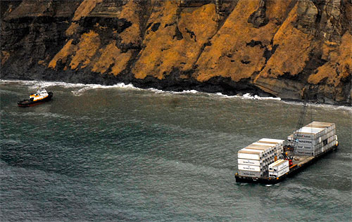 jpg Response crews remove tug, barge from beach near Cold Bay 