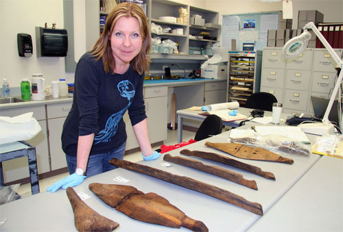 jpg Researcher Jenya Anichenko poses with the umiak pieces discovered in the Birnirk collection at the University of Alaska Museum of the North and dated at 1,000 years old