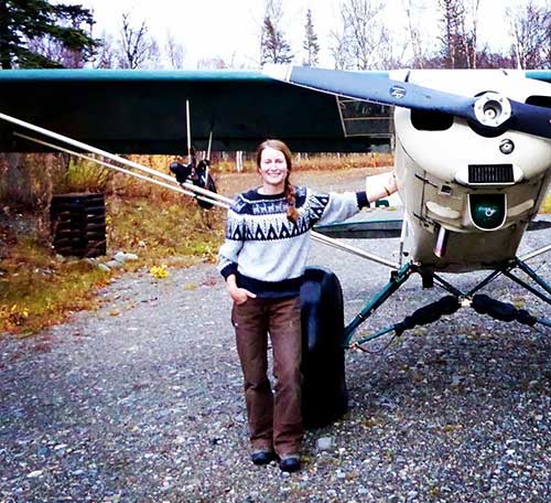 jpg Tia Shoemaker, hunting guide and bush pilot on the Alaska Peninsula, next to her family's plane.