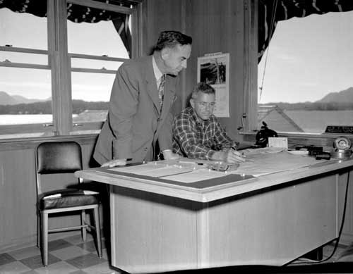 jpg Bob Ellis at his desk during the search for the Hall plane, August 1953