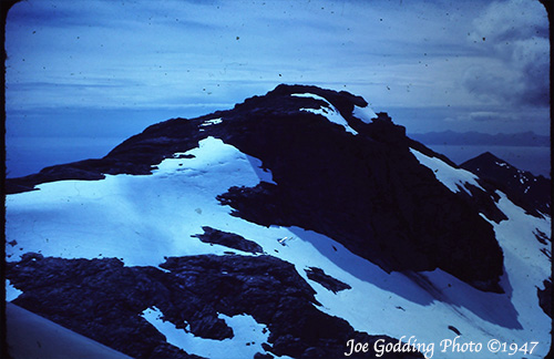 jpg The tail assembly of Pan American Flight 923 can just barely be seen in the center of the photo near the peak of Tamgas Mountain. 
"Joe Godding photos©, courtesy of Jessica Foster." 