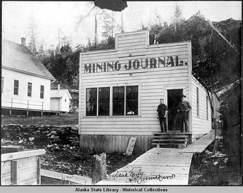 jpg Front of small wooden building housing Ketchikan's newspaper "Mining Journal", signed "Yours Truly A.P. Swineford"