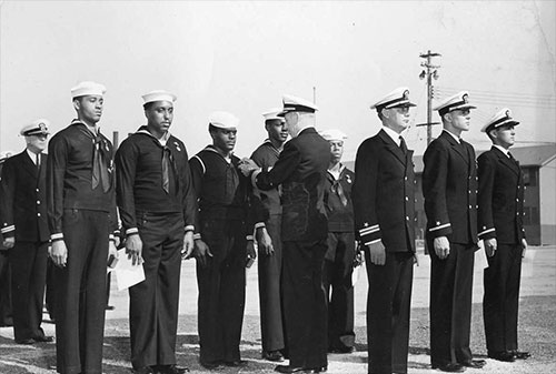 jpg Rear Admiral Carlton H. Wright pinning the Navy and Marine Corps Medal on Seaman 1st-class James A. Camper, Jr. for heroism displayed following the Port Chicago munitions explosion 17 Jul 1944. 