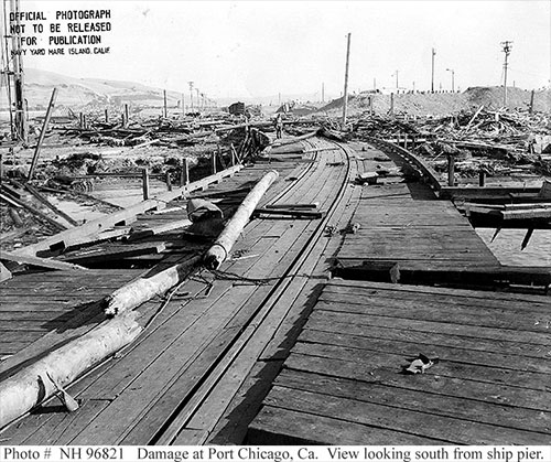 jpg View from the demolished pier looking toward shore and more flattened buildings following a munitions explosion at Port Chicago, California, United States, 17 Jul 1944. 18 Jul 1944 photo.