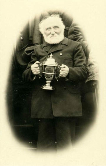 jpg Father William Duncan of the Church of England in Alaska holding a silver cup. n.d. Photographer: Alice O. Swanson. William Duncan, 1832-1918 