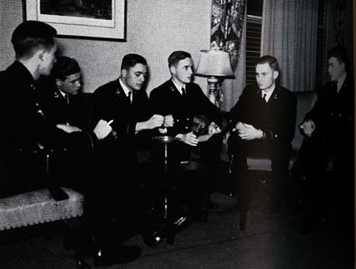 jpg Thompson, far left, meeting with other officers in the USNA "boat club"