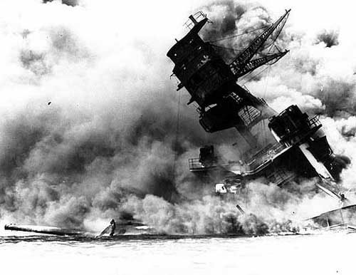 jpg The forward superstructure and Number Two 14"/45 triple gun turret of the sunken USS Arizona (BB-39), afire after the Japanese raid, 7 December 1941.